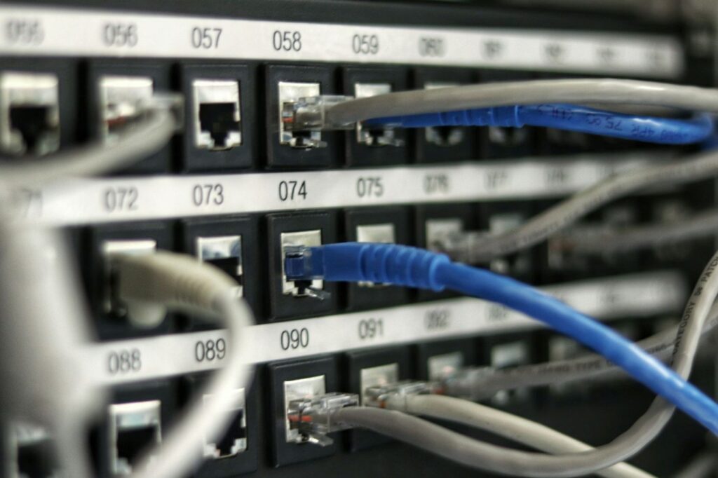Data cabling plugged into a network patch panel