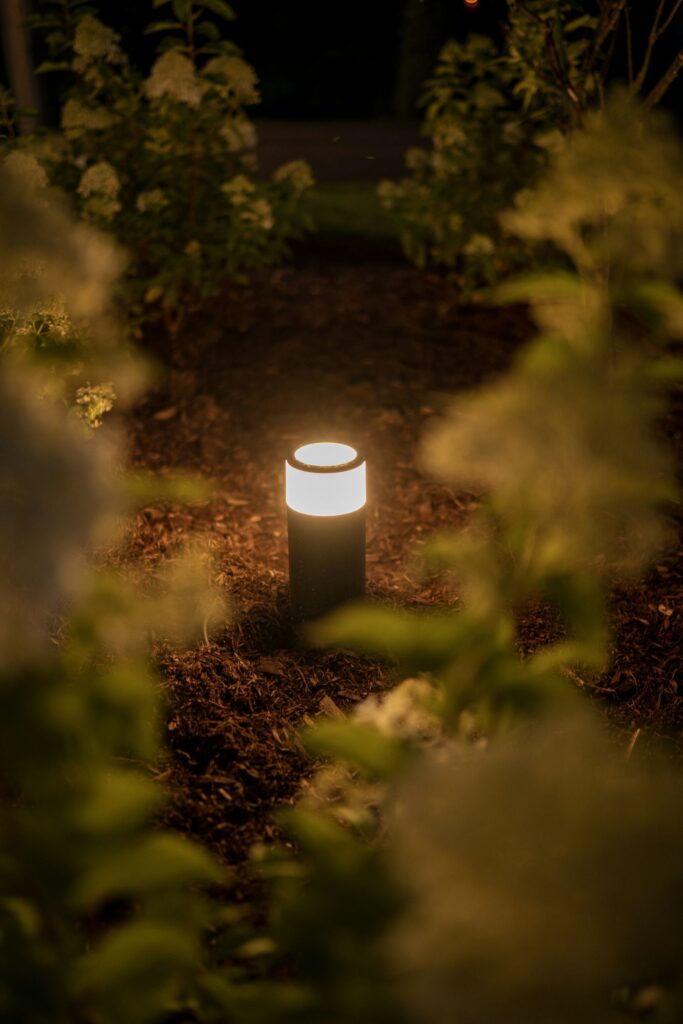 Garden path light glowing at night